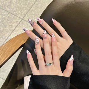 Pink leopard print almond press-on nails with luxury rhinestones and 3D heart gems