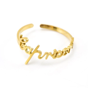 Macro shot of Capricorn typography design on a gold stainless steel adjustable ring