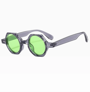 Detailed side view of polygon round sunglasses with translucent purple frames and green lenses