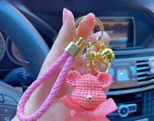 Pink woven texture bear keychain with gold clasp and leather strap for bags