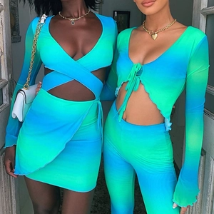 Detail of blue-green gradient tie-front cropped top and high-waisted shorts on models