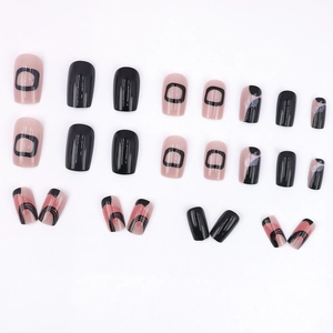 Short square press-on nails with minimalist black geometric lines and nude pink tones