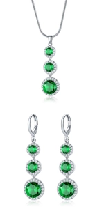 Detailed close-up of teardrop emerald jewelry set with zircon halo on silver chain