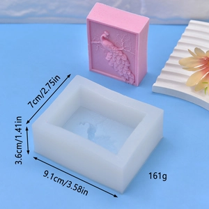 Detail view of rectangular silicone mold with peacock flower relief and product dimensions