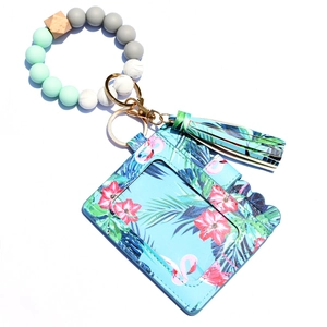 Wristlet keychain card holder with tropical flamingo print, silicone beads, and wood accents