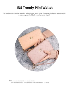 Detail of long double zipper wallets with geometric quilted texture and heart metal buckle
