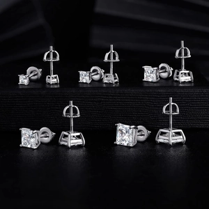 Set of five silver square zircon stud earrings in various sizes on black background