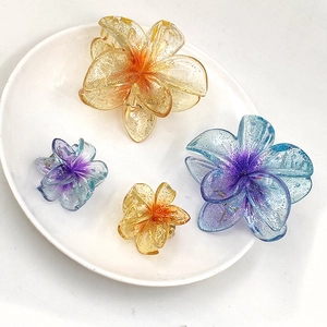 Transparent glitter plumeria hair claw clips set in yellow and blue gradient colors