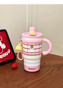 Detailed view of pink cartoon straw cup with dual handles and ceramic lining