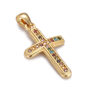 Close-up of gold-plated cross pendant featuring inlaid colorful gemstones on white background