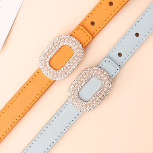 Elegant thin faux leather belts in orange and blue with pearl rhinestone buckles