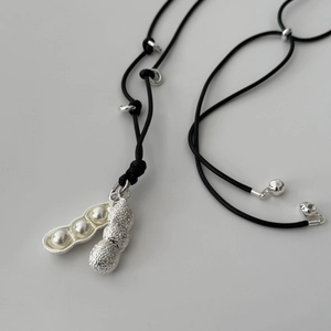 Modern silver peanut pendant necklace with white pearls on adjustable black rope cord