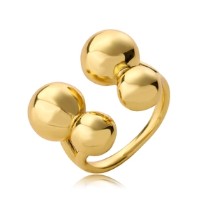 Minimalist gold bypass open ring featuring four polished spheres in a geometric style