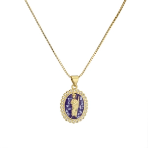 Golden Virgin Mary necklace with zircon-inlaid oval pendant on a white background