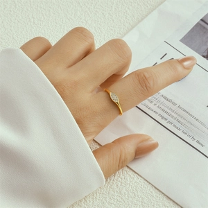 Detail view of a 925 silver double layer ring with small diamonds on model finger