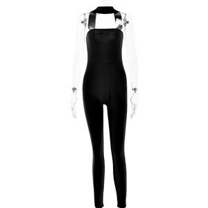 Detail of black halter neck jumpsuit featuring a backless design and slim-fit silhouette