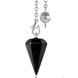 Detail of a black obsidian hexagonal cone pendulum with a silver chain and textured bead