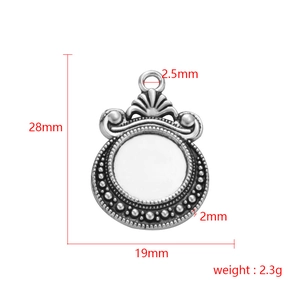 Detail view of antique silver scale pendant showing 28mm height and dimensions