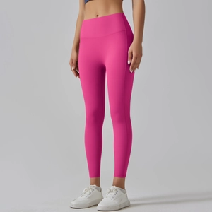 Detailed view of high-waisted fuchsia yoga pants with side pockets and seamless finish