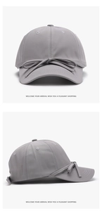 Detail view of quick-dry dark grey baseball cap featuring a large decorative bow