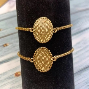 Golden oval Virgin Mary bracelet with colorful zircon stones and adjustable link chain