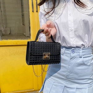 Chic black quilted leather crossbody bag with gold chain and metal buckle for women