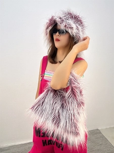 Detail view of purple and white gradient faux fur plush hat with matching fuzzy handbag
