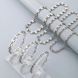Detailed view of silver stainless steel coffee bean link necklace and bracelet set