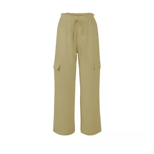 Detail of light khaki cargo trousers featuring elastic drawstring waist and side flap pockets