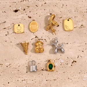 Selection of 18K gold and silver plated pendants with bear, balloon dog and lucky charms