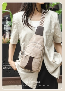 Detail of chest bag with color-block patchwork and geometric pattern wide shoulder strap