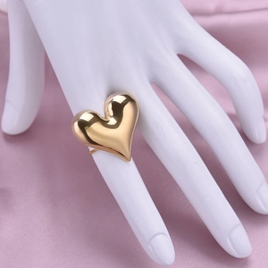 Adjustable 18K gold plated stainless steel heart ring shown on model's hand