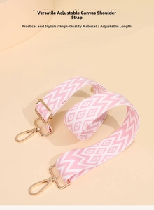 Close-up of adjustable pink and white bohemian canvas strap with gold metal hooks