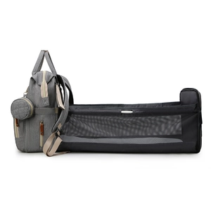 Gray multifunctional diaper bag backpack featuring a built-in portable folding baby crib