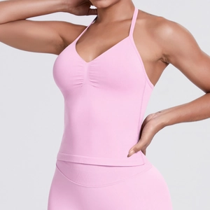 Detailed view of pink seamless yoga sports bra with thin straps and gathered chest design