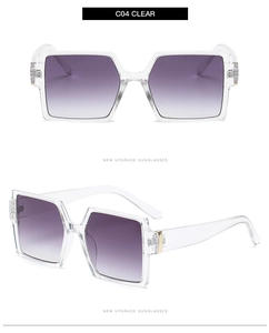 Detail view of transparent square sunglasses with purple gradient lenses and gold hinges