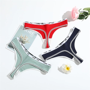 Three-pack of ribbed cotton thongs in red, mint green, and navy blue with LOVE YOU waistband