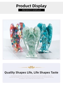 Detail showing three resin angel figurines with light green, blue, and colorful crystal stones