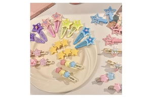 Flat lay of colorful macaron star-shaped hair clips and cute animal pins for girls