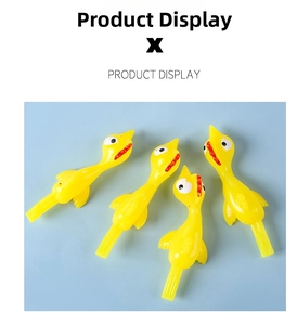 Close-up of four yellow TPR slingshot chickens on a light blue background for funny pranks