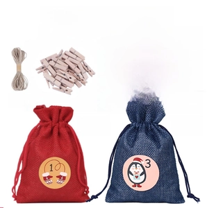 24-piece Christmas advent calendar set with red and blue burlap bags, clips and stickers