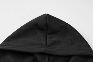 Close-up detail of the hood stitching on a black zip-up knitted cardigan for women