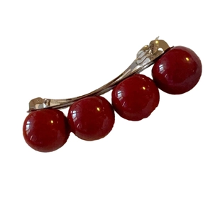 Vintage horizontal barrette featuring four glossy deep red beads on a silver metal spring clip
