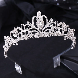 Macro shot of silver wedding tiara with sparkling crystal rhinestones and pear-cut stone