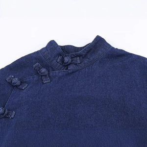 Dark blue denim cape top featuring traditional Chinese mandarin collar and frog button closure