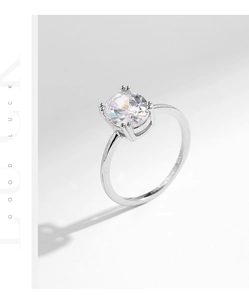 Close-up of S925 sterling silver ring with oval sparkling cubic zirconia in four-prong setting