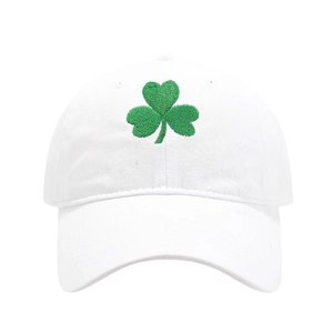Detailed view of green shamrock embroidery on white cotton Saint Patrick's Day baseball cap