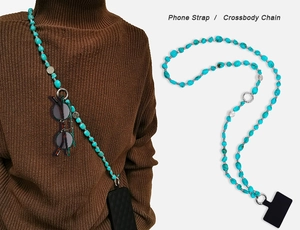 Detailed view of a turquoise beaded phone strap used as a stylish crossbody chain