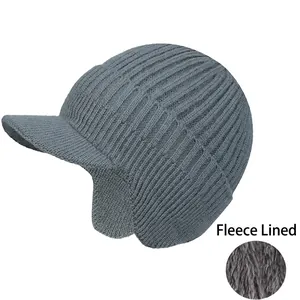 Detail view of grey knit beanie with fleece lining and ear protection for winter