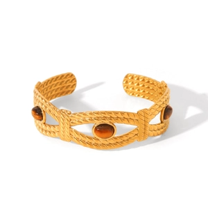 Bracelet manchette vintage en acier titane doré orné de pierres œil de tigre ovales